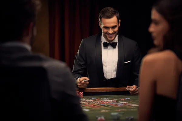A woman in a luxurious green gown next to an ornate roulette wheel, capturing the upscale casino mood of CU888.